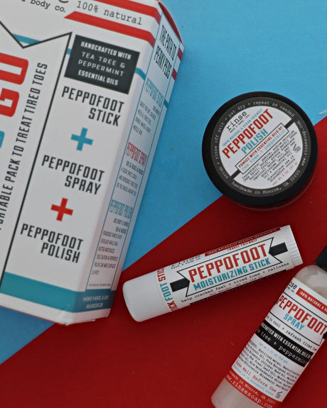 The Pedi-to-Go set laid out on red and blue card — Peppofoot Stick, Spray and Polish