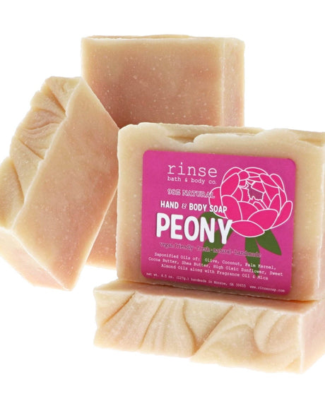 Peony soap stack shows hot-pink peony label — soft pink marble cream bars on clean bright white
