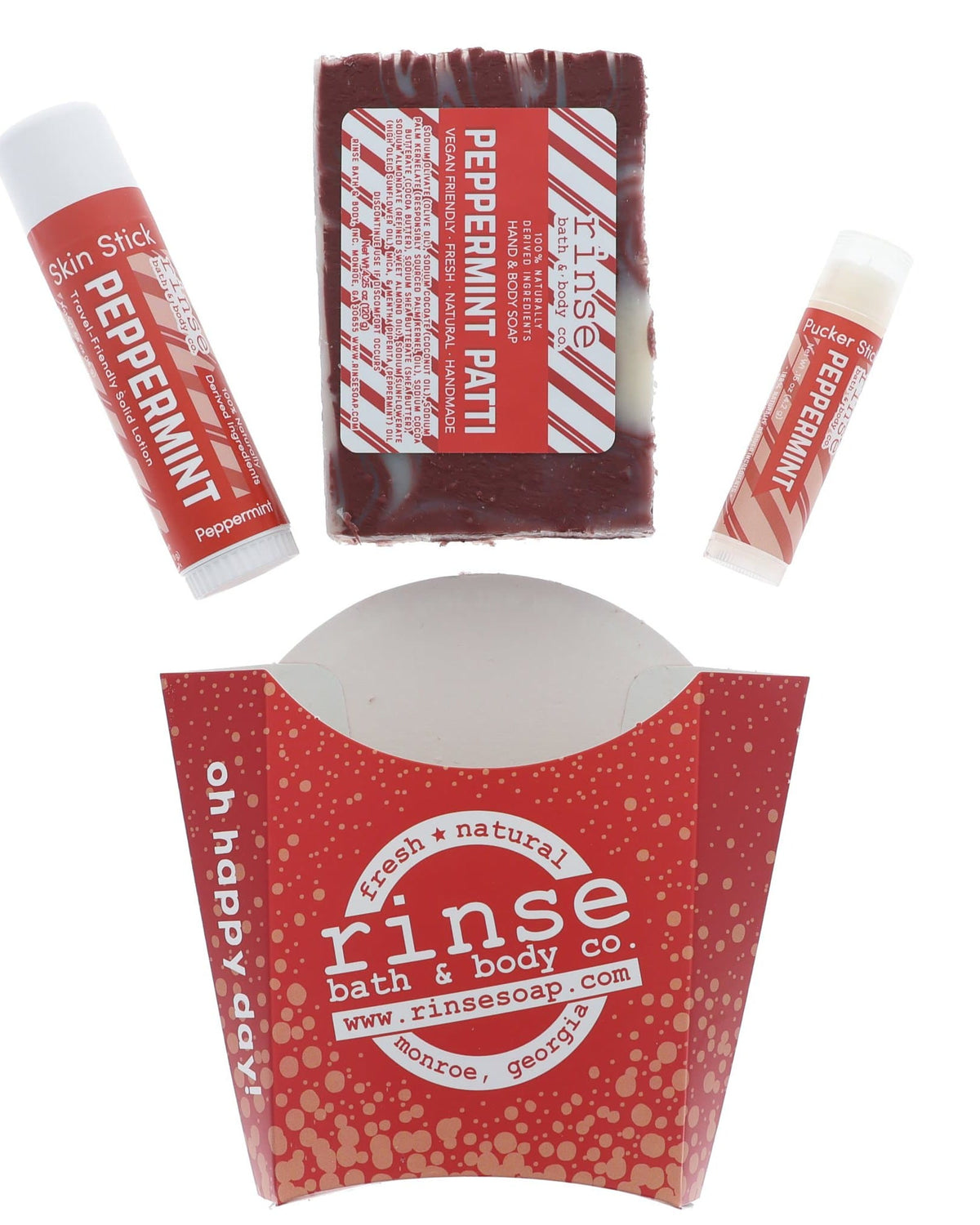 Peppermint Patti laid flat — bar soap, Skin Stick, and Pucker Stick above the red dotted fry carton