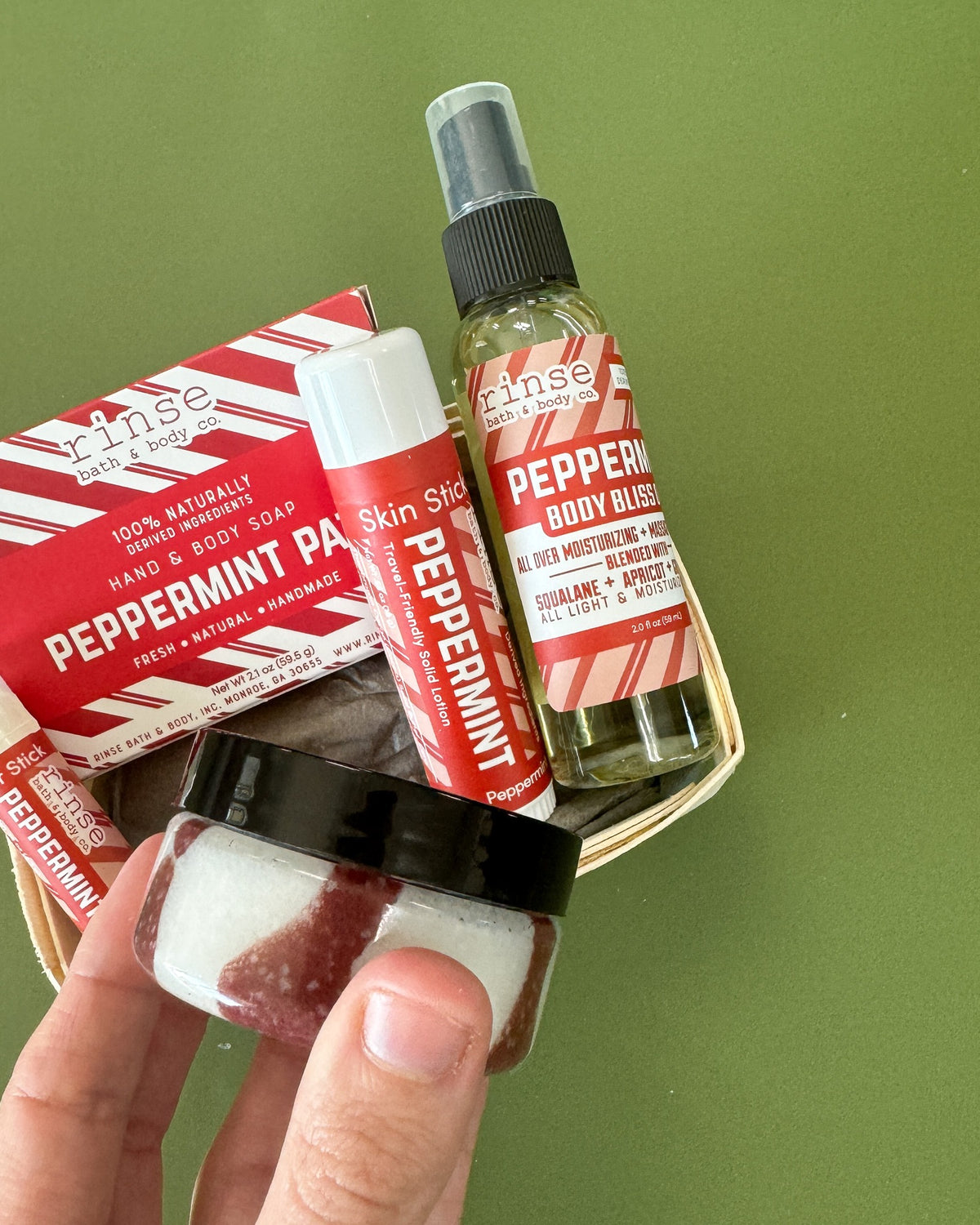 Peppermint Patti travel set on green — new candy-stripe labels in a wooden berry till, ready-to-gift