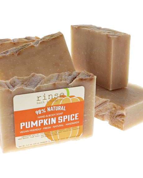 Pumpkin Spice soap stylized on bright white — cream speckled bars stacked with orange pumpkin label