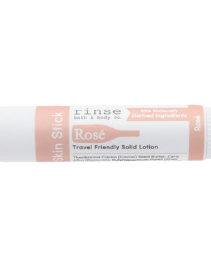 Rose solid lotion stick — dusky real-rose florals in a twist-up bar of moisture. Rinse Bath & Body Co.