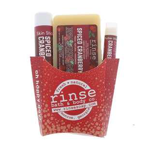 Red fry carton holding Spiced Cranberry soap Skin Stick and Pucker — cranberry labels on bright white