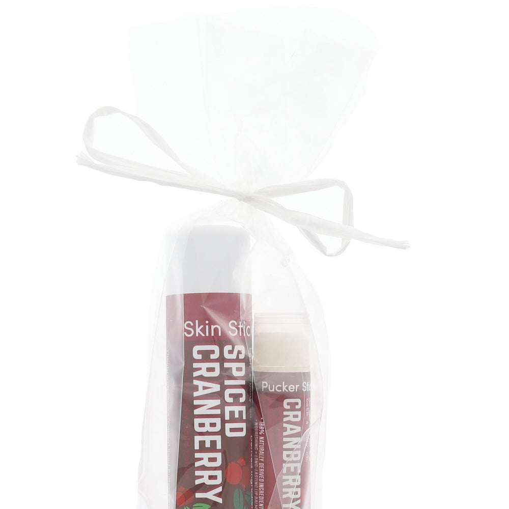 Maroon Spiced Cranberry stick duo nestled in sheer white mesh — ribbon bow on clean bright white