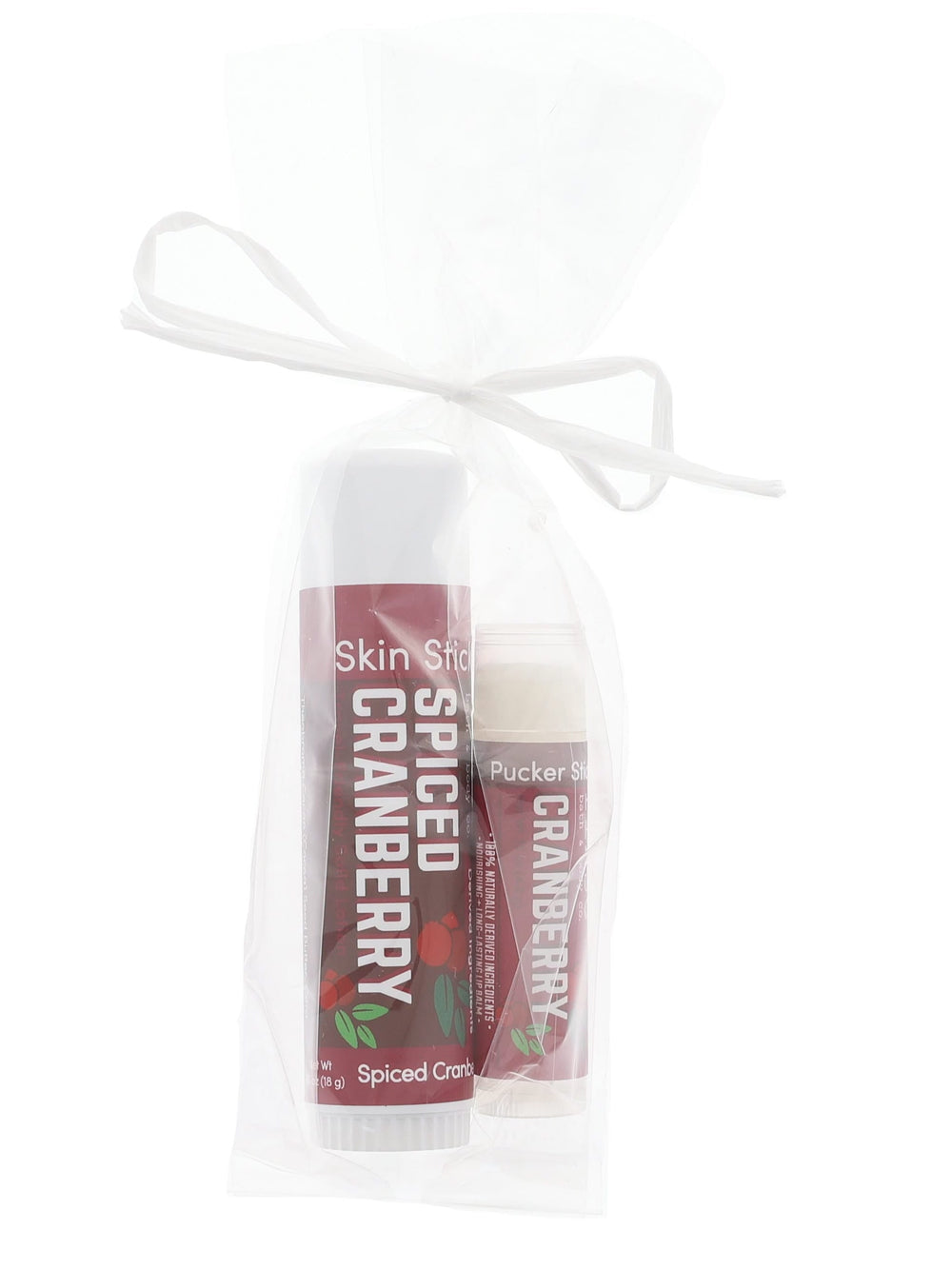 Maroon Spiced Cranberry stick duo nestled in sheer white mesh — ribbon bow on clean bright white