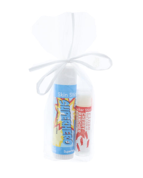 Superhero Skin Stick and Cherry Rancher Pucker Stick standing in sheer gift bag — gift-ready as-arrives duo