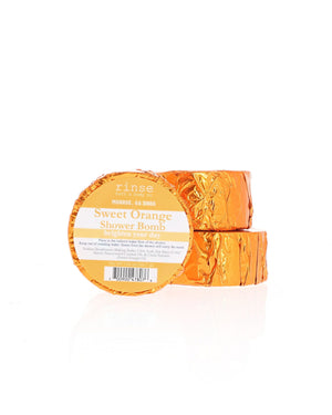 Two Sweet Orange Shower Bombs stack in foil wrap with the current Rinse label; shown for display; listing is for one (1)