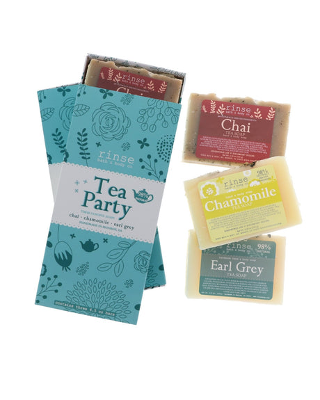 Tea Party soap gift set flat lay — Chai, Chamomile, and Earl Grey bars with teal Tea Party gift box