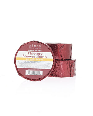 Two Thievery Shower Bombs stack in foil wrap with the current Rinse label; shown for display; listing is for one (1)