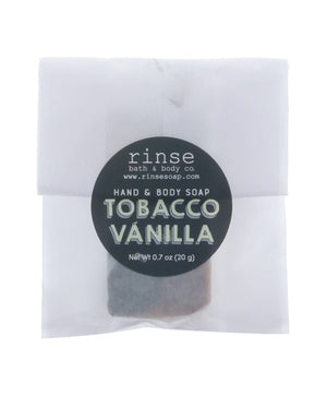 Tobacco Vanilla soap slice in frosted glassine — black circle sticker on clean bright white