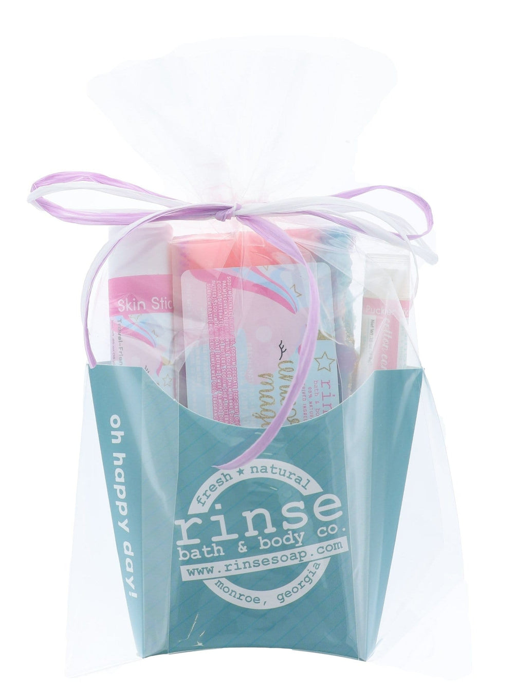 The Unicorn Magic gift set wrapped in cellophane and tied with a lilac ribbon bow — arrives gift-ready, no wrapping needed. Rinse Bath & Body Co.