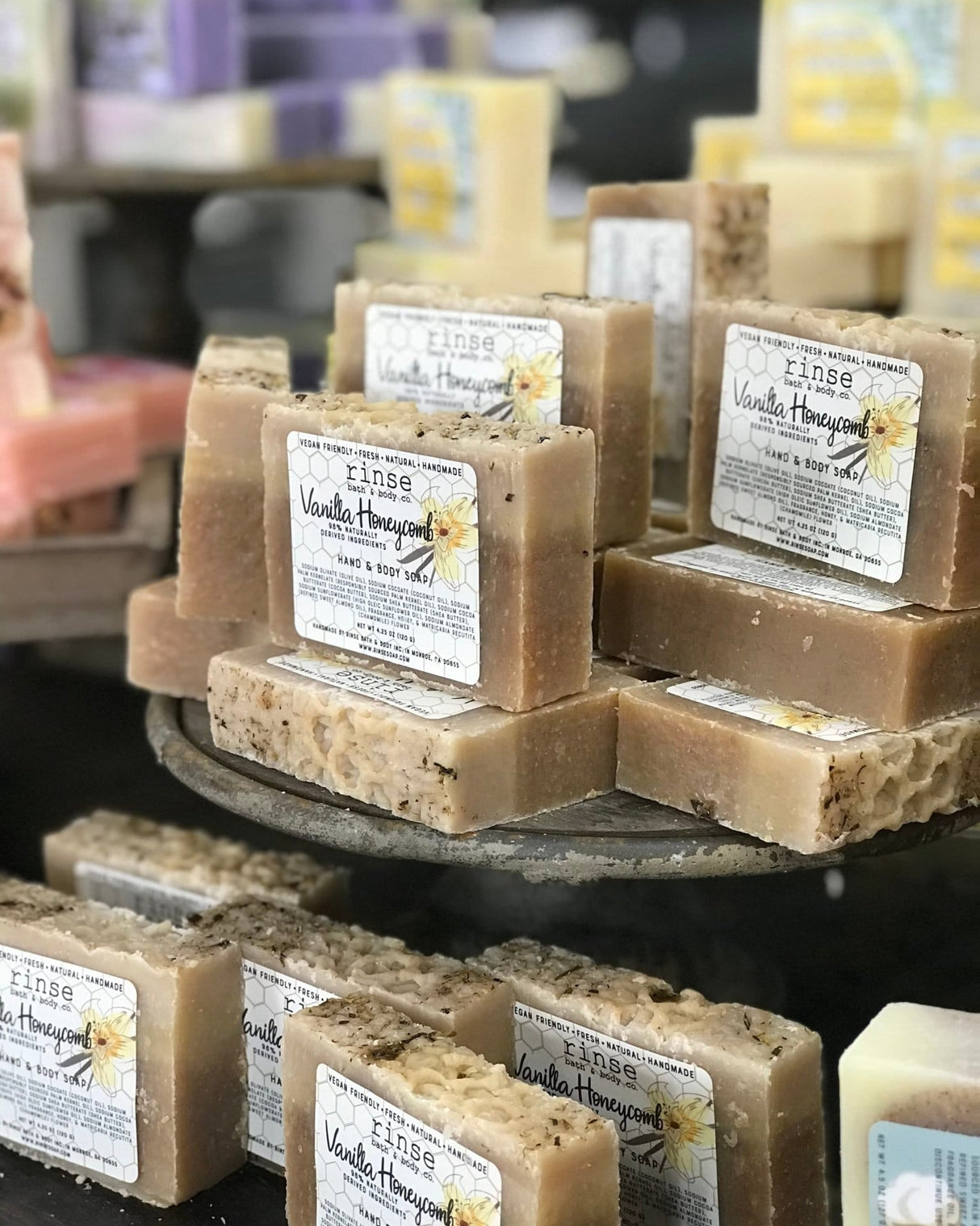 Vanilla Honeycomb bar soap with its honeycomb-print label — warm vanilla over real honey in a cocoa-butter base. Rinse Bath & Body Co.
