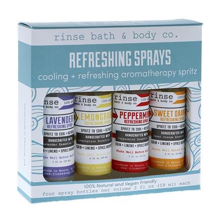 Four mini Refreshing Sprays nestled in an open light-blue gift box — lavender lemongrass peppermint and sweet orange under clean white light