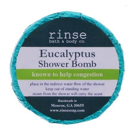 Teal-foil Eucalyptus Shower Bomb faces up — lime stripe label crisp on clean bright white