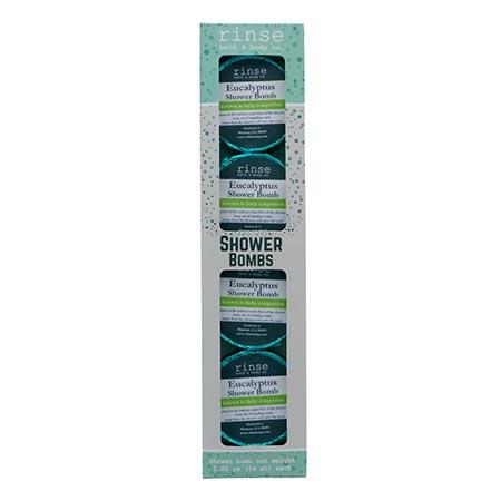 Tall Eucalyptus Shower Bombs carton stands alone — teal windows glowing on stark white studio