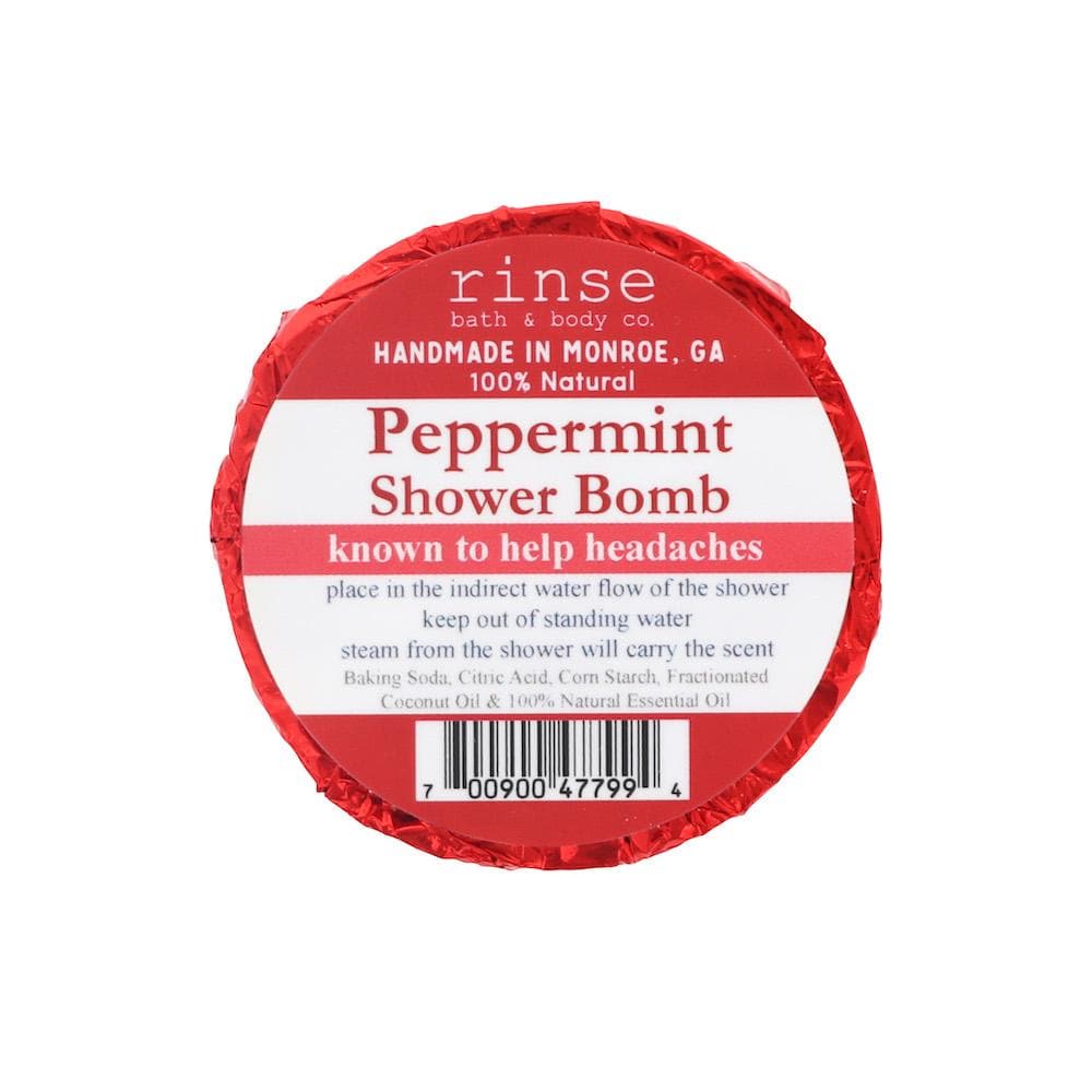Red-foil Peppermint Shower Bomb faces up — white circle label crisp on clean bright white