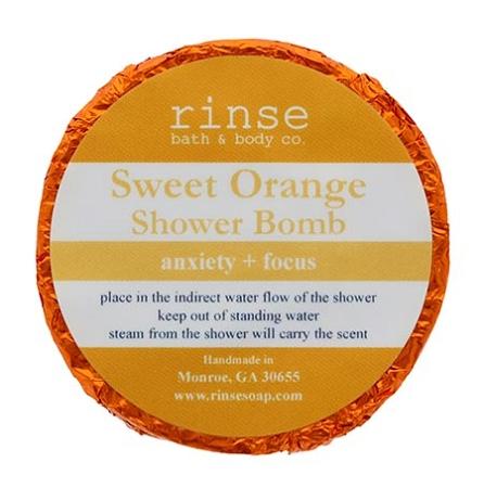 Orange-foil Sweet Orange Shower Bomb faces up — circle label crisp on clean bright white