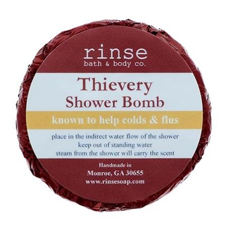 Thievery Shower Bomb top-down in dark red foil — cream label framed by metallic crinkle on white
