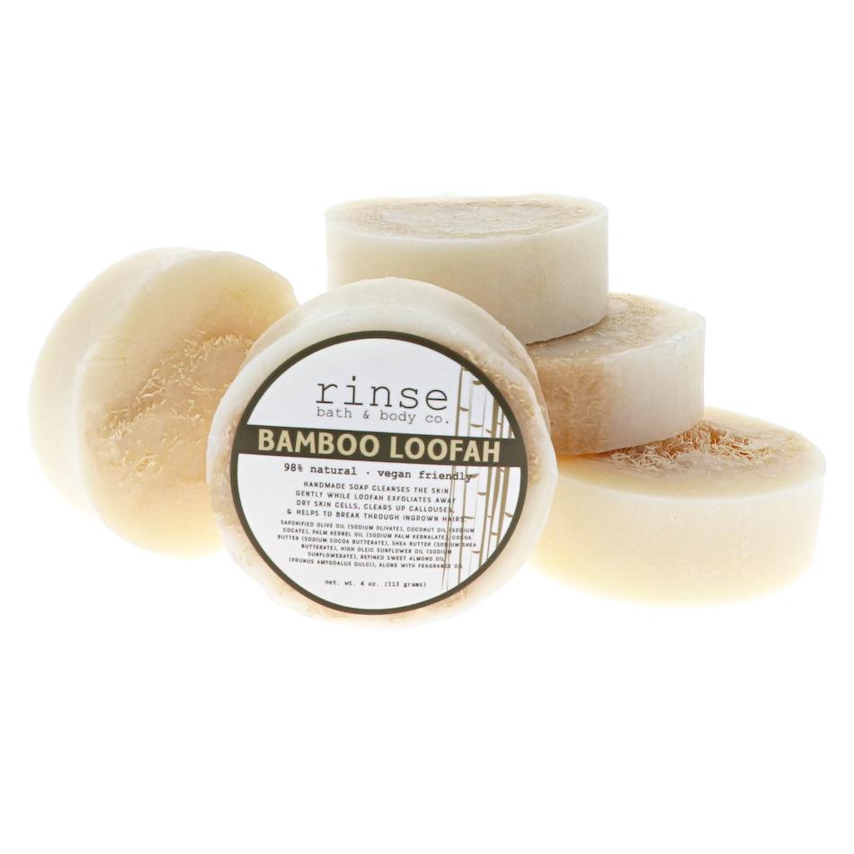 Five Bamboo Loofah soap discs stack and face forward — fibrous tan loofah rings on clean bright white