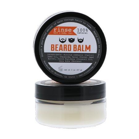 Two Beard Balm jars stacked on bright white — creamy off-white balm behind black lids and orange labels