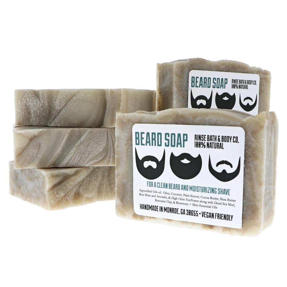 Stacked Beard Soap bars show thick marbled sides — grey-cream swirls and beard icons on stark white