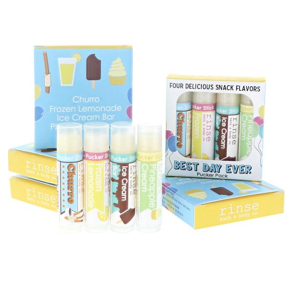 Churro Frozen Lemonade Ice Cream Bar and Pineapple Cream Pucker Sticks lined before their gift box — pastel tubes on white