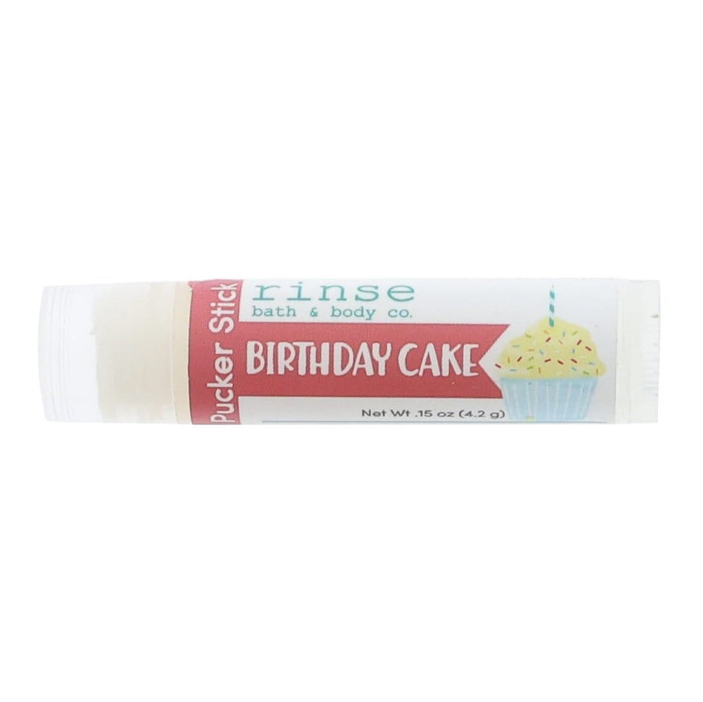 Birthday Cake Pucker Stick lying on bright white — pink type and cupcake candle art in clean studio light