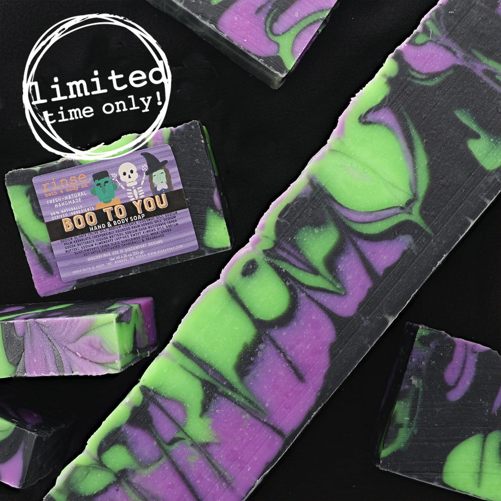Boo To You soap pieces scattered on black with limited-time stamp — electric green purple swirls in studio light
