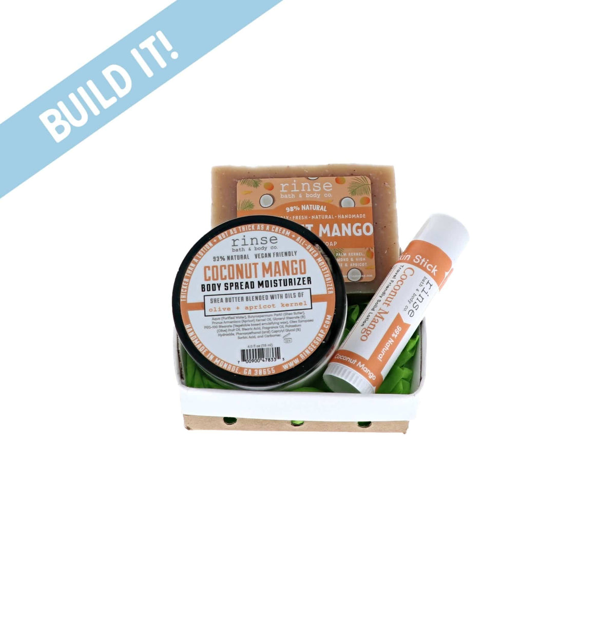 Coconut Mango Body Spread soap and Skin Stick nest in a ceramic basket — bright green filler on clean white