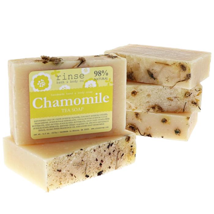 Chamomile Tea Soap stack shows botanical-flecked sides — yellow label crisp on clean bright white