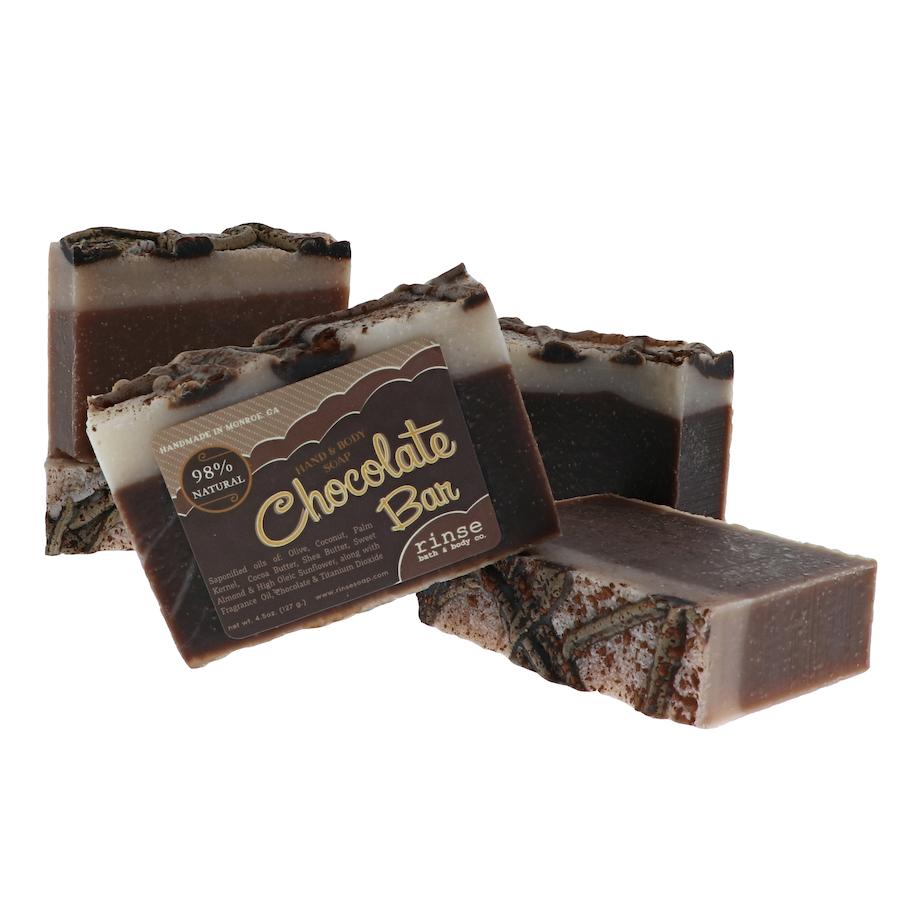 Four Chocolate Bar soaps face forward — dark brown base and cream swirl tops on clean bright white