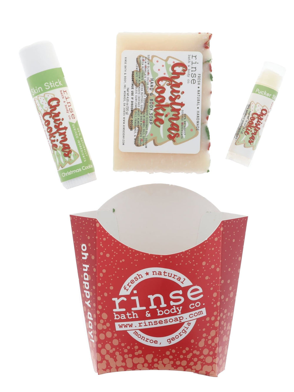 Christmas Cookie pieces above a red dotted fry carton — soap Skin Stick and Pucker in studio light