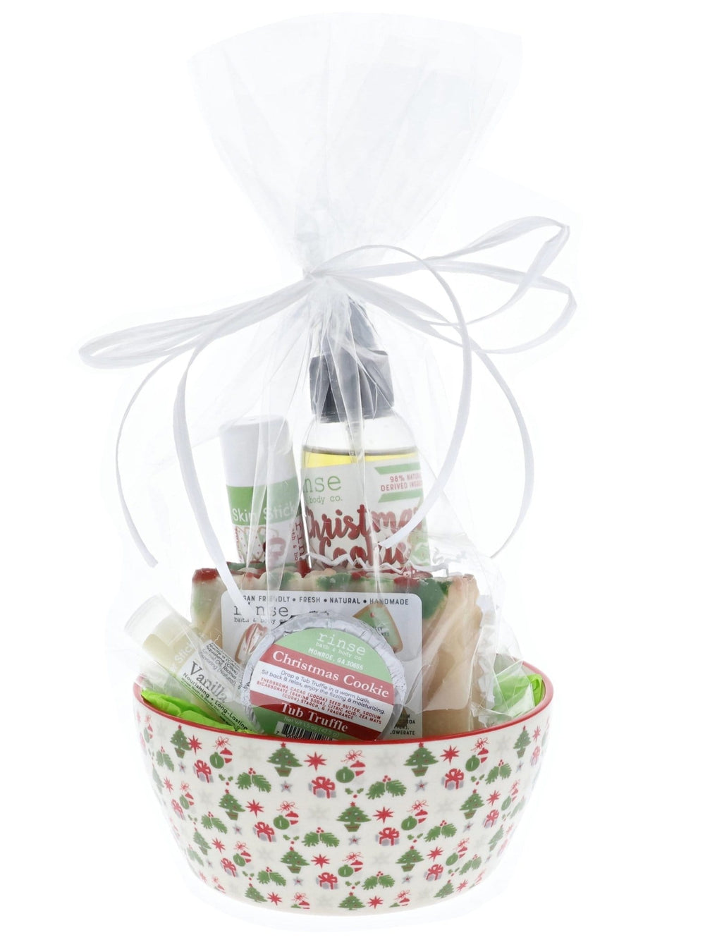Christmas Cookie holiday bowl gift wrapped in clear cellophane with white raffia — tree-berry ceramic under bright light