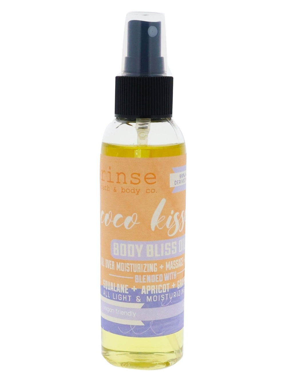 Coco Kissed Body Bliss Oil standing on bright white — lavender-orange label and golden spray in clean studio light