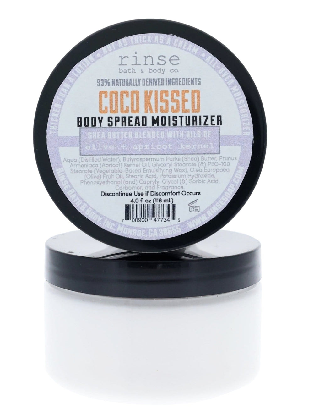 Coco Kissed Body Spread jar with lid propped upright on bright white — purple-orange label in clean studio light