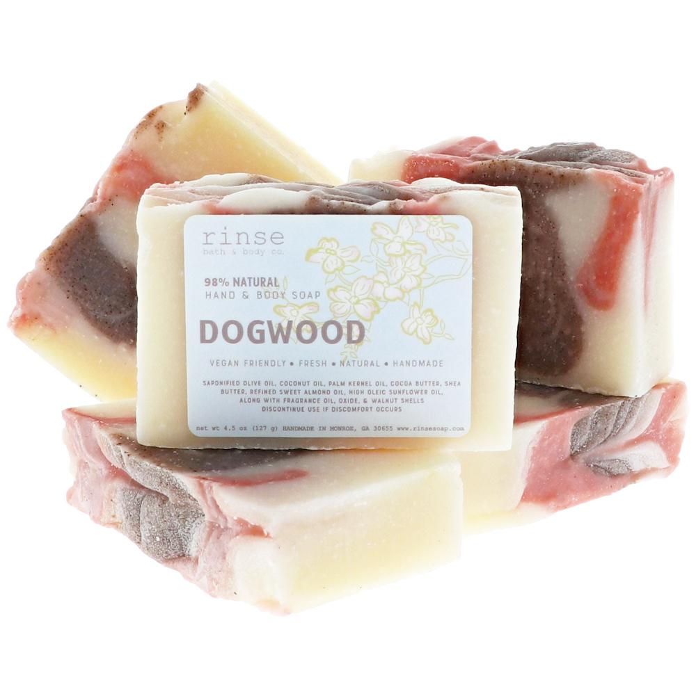 Cotton soap pile reveals earthy pink and cocoa swirls — handmade bars on stark white studio
