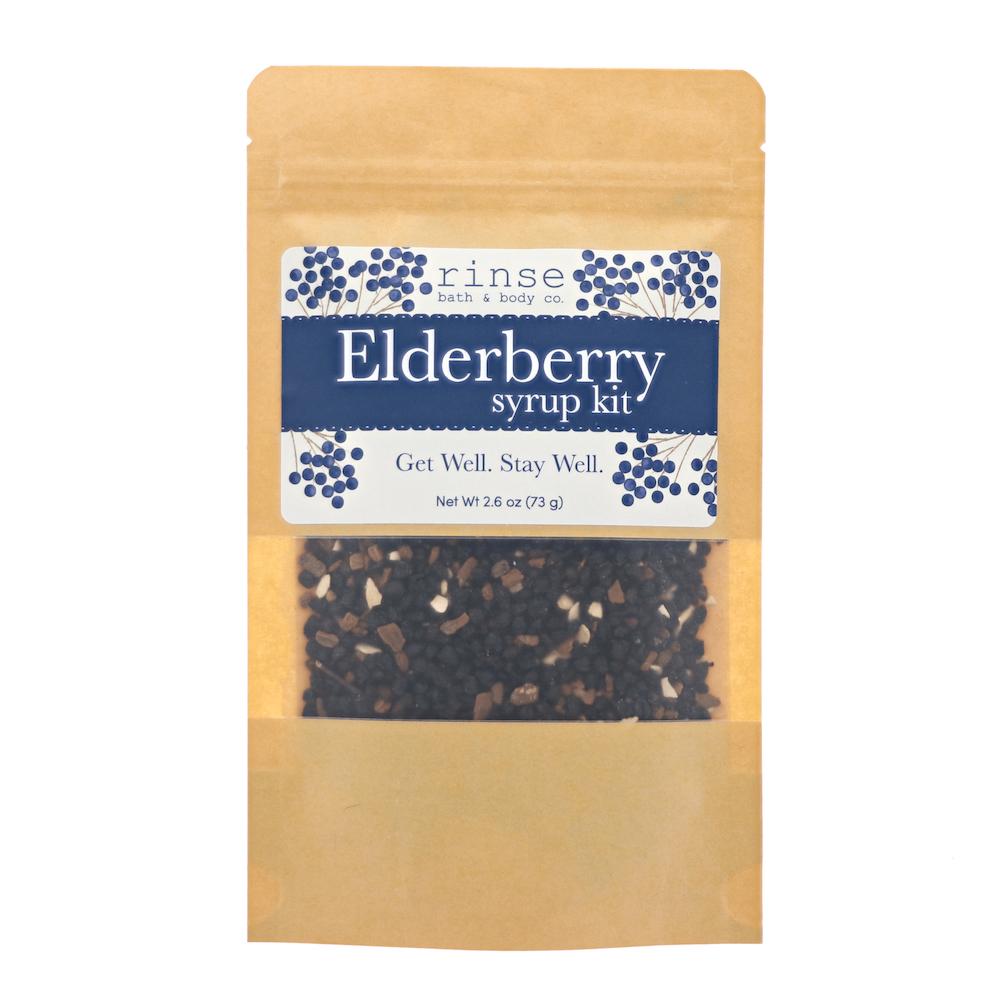 Elderberry syrup kit kraft pouch showing dried berries through a clear window — navy botanical label on bright white