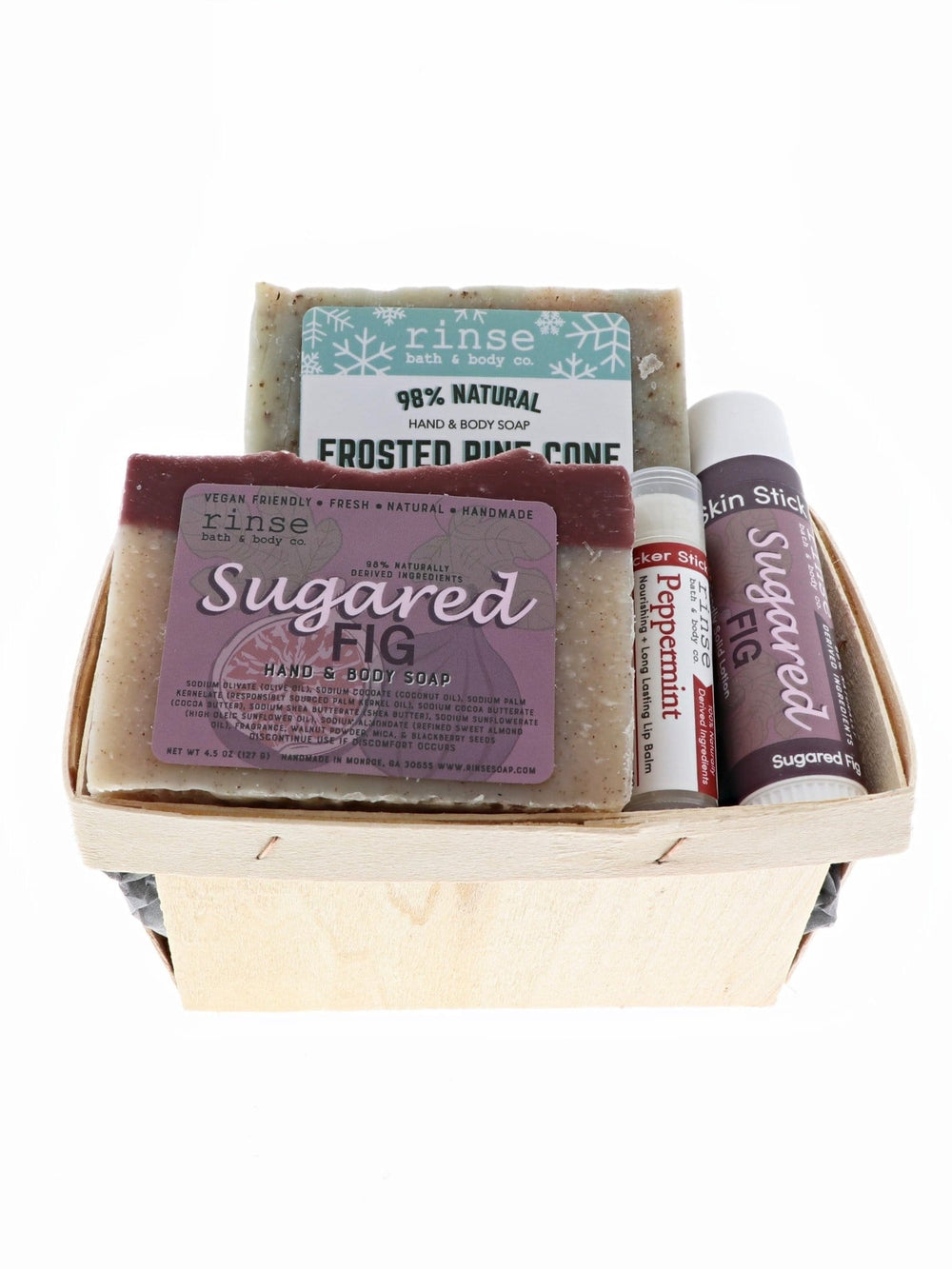 Wooden berry till cradling Frosted Pine Sugared Fig soap and lip care — compact holiday gift on white