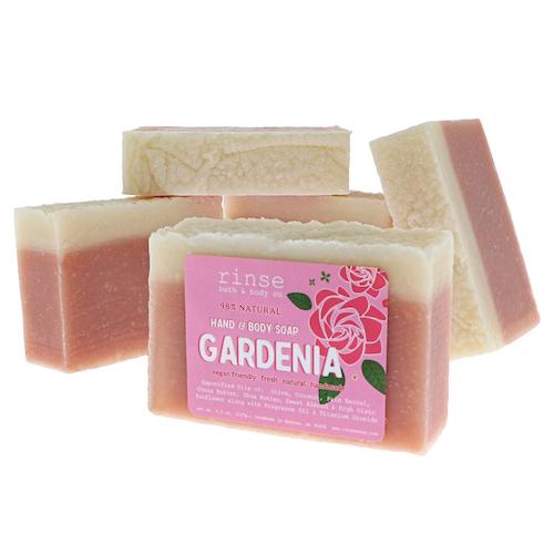 Stacked Gardenia bars reveal dusty rose bottoms — cream tops on stark white studio