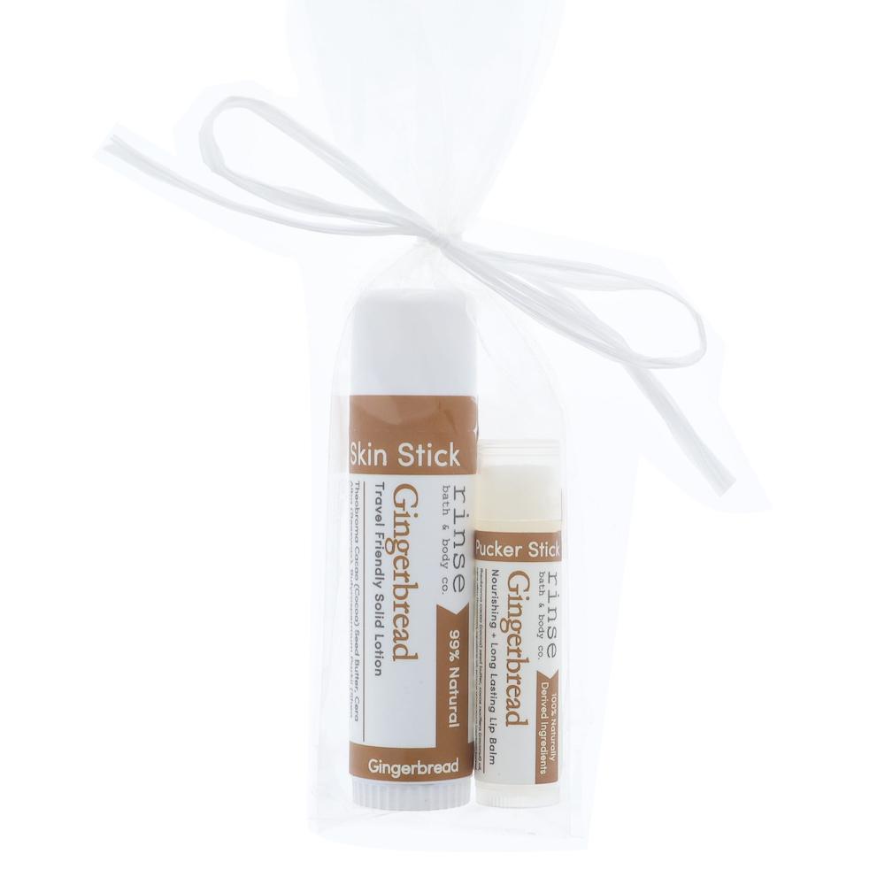 Gingerbread Skin Stick and Pucker Stick tucked in sheer white mesh — warm brown labels on bright white