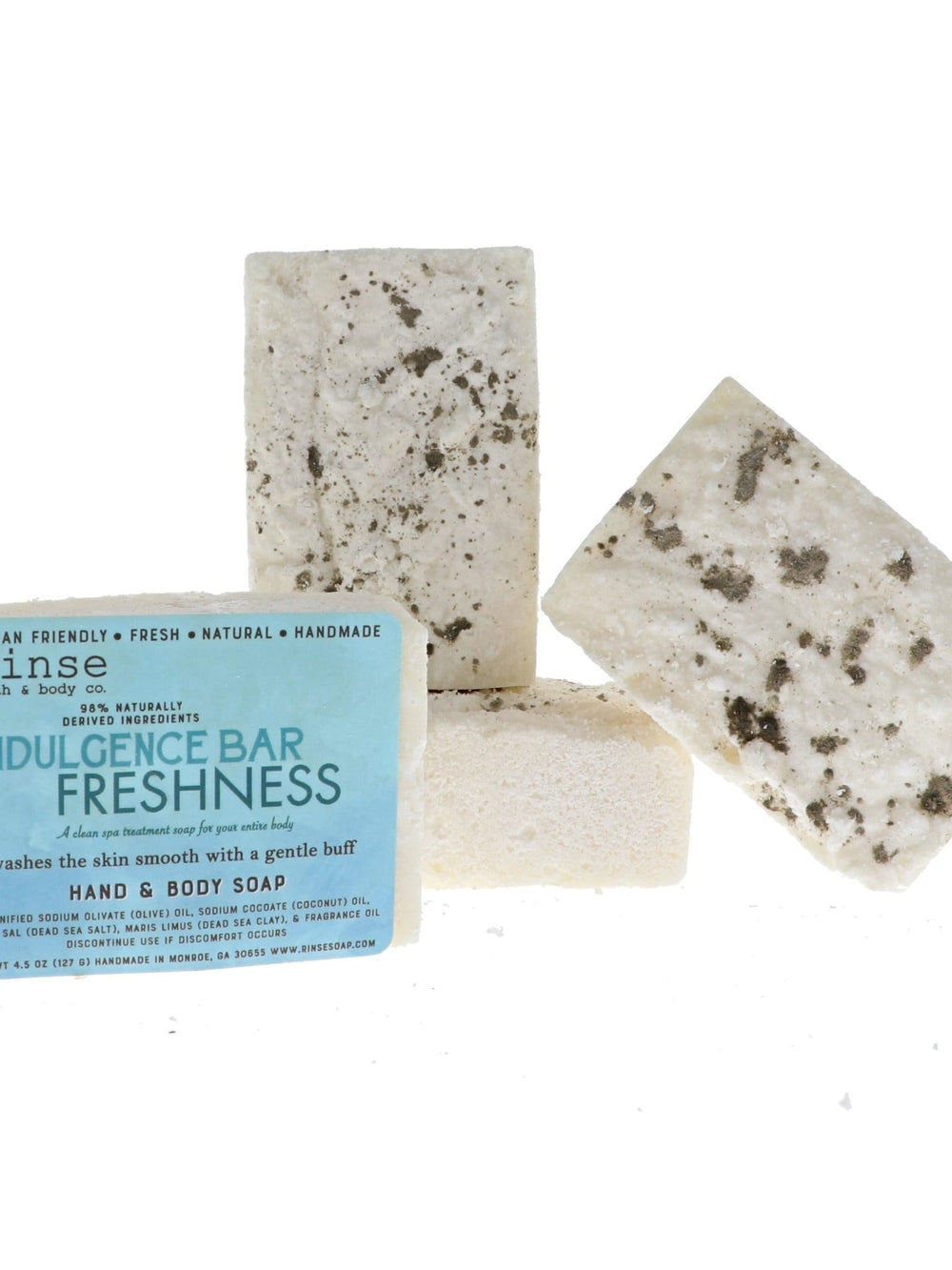 Indulgence Bar Freshness soaps leaning together in bright studio light — creamy bars with mineral clay and salt grit