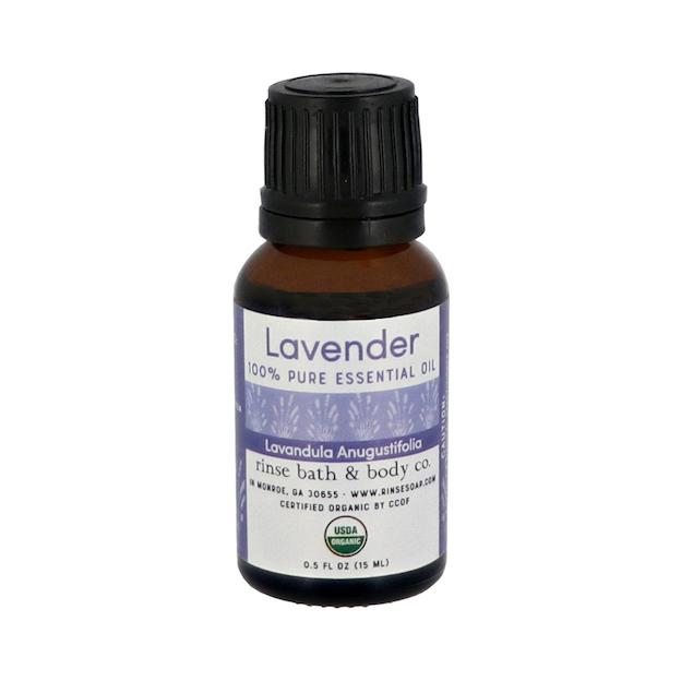 Lavender 100% Pure Essential Oil bottle centered on bright white — amber glass and black ribbed cap ready for aroma
