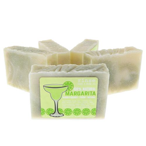 Front Margarita bar leads a fan of cream-green soaps — cocktail glass sketch on stark white
