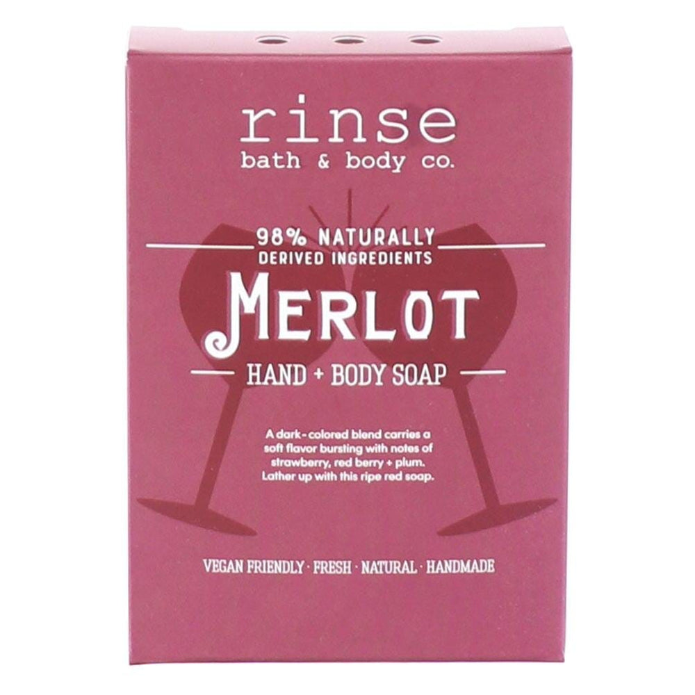 Merlot soap carton standing upright on bright white — berry-red packaging with wine-glass silhouettes