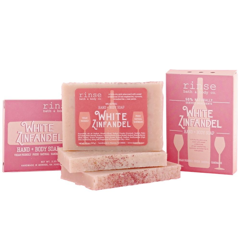Mini White Zinfandel soaps and pink wine-bottle boxes cluster — soft shadows on seamless white