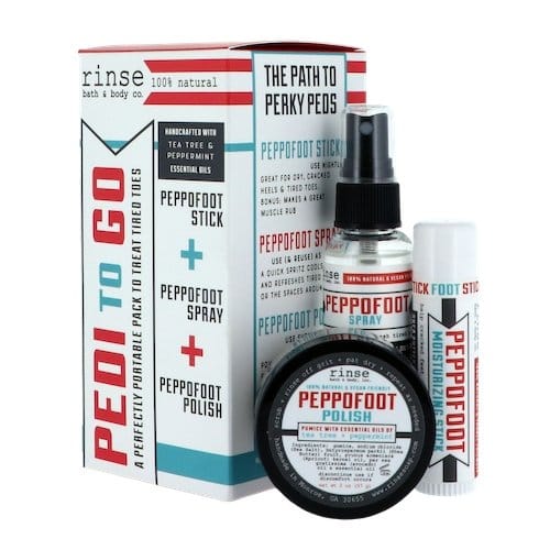 Pedi To Go box sits beside three foot-care pieces — teal and red accents on studio white