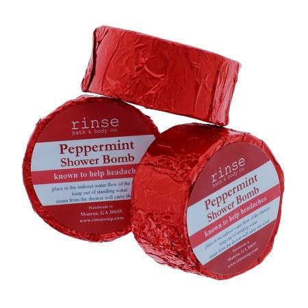 Three red-foil Peppermint Shower Bombs stack — shiny crinkled wrap on bright white