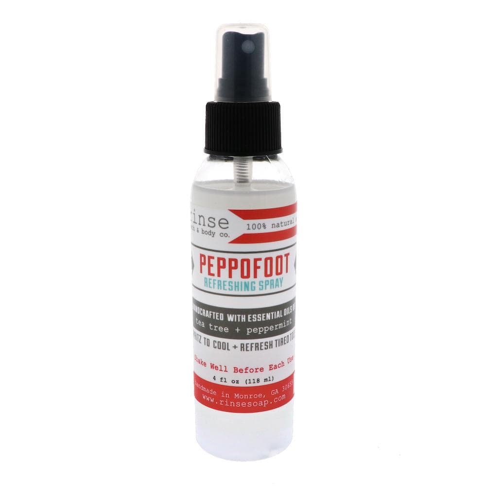 Peppofoot Refreshing Spray standing on bright white — clear bottle with bold red Peppofoot label and black pump
