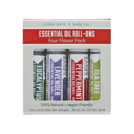 Essential Oil Roll-Ons four-pack box centered on white — red banner and window showing Eucalyptus Lavender Peppermint Tea Tree