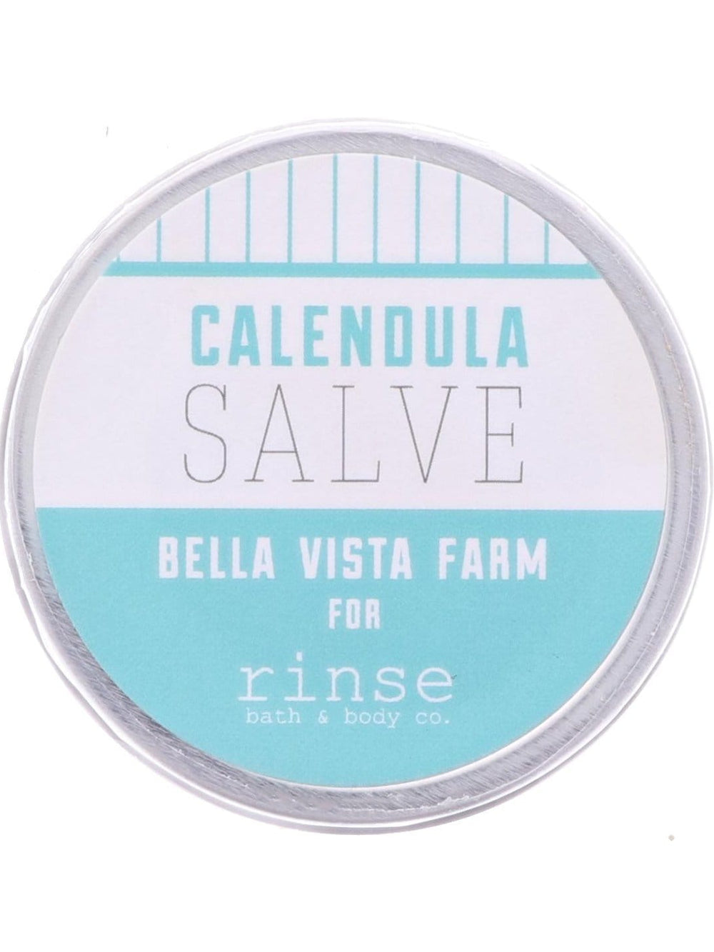 Closed Calendula Salve tin resting on bright white — aqua-and-white striped lid in clean studio light